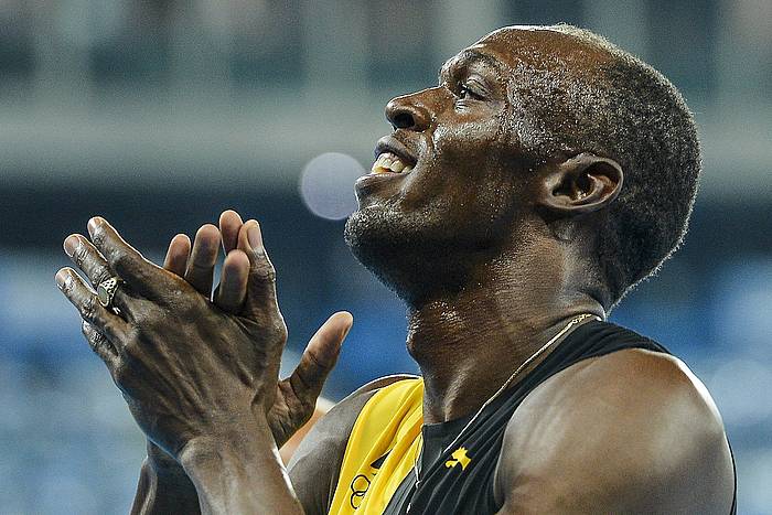 Bolt, hirugarren urrea ospatzen. ZSOLT CZEGLEDI / EFE