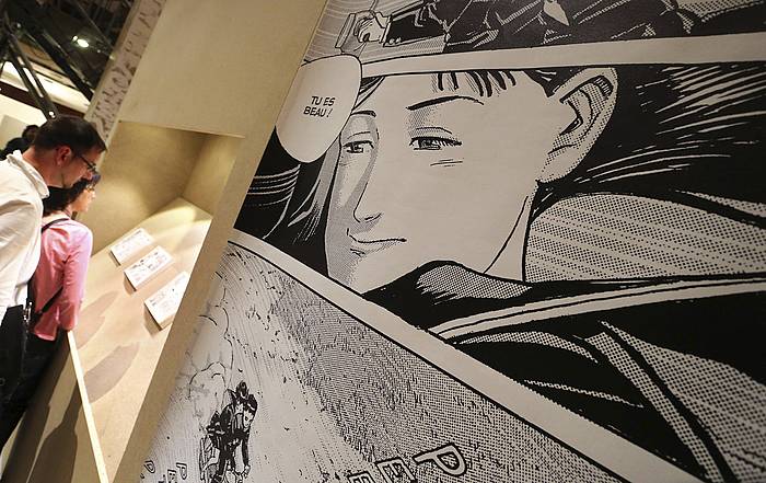 Zenbait pertsona iaz Alemanian Taniguchiren lanak ikusten, Erlangeneko Komiki Azokan. KARL-JOSEF HILDENBRAND, EFE